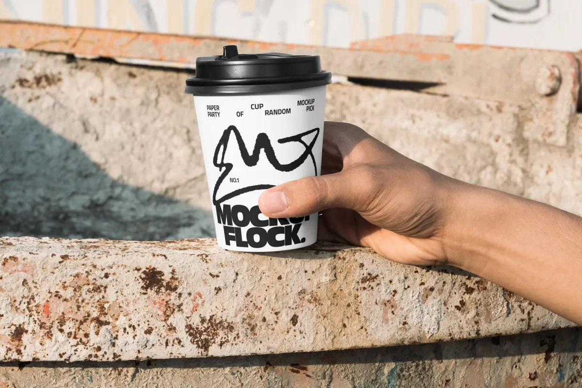 Hand-Held Coffee Cup Mockup