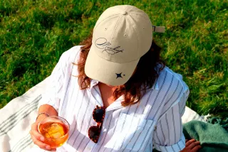 Cap Mockup on Model at Picnic