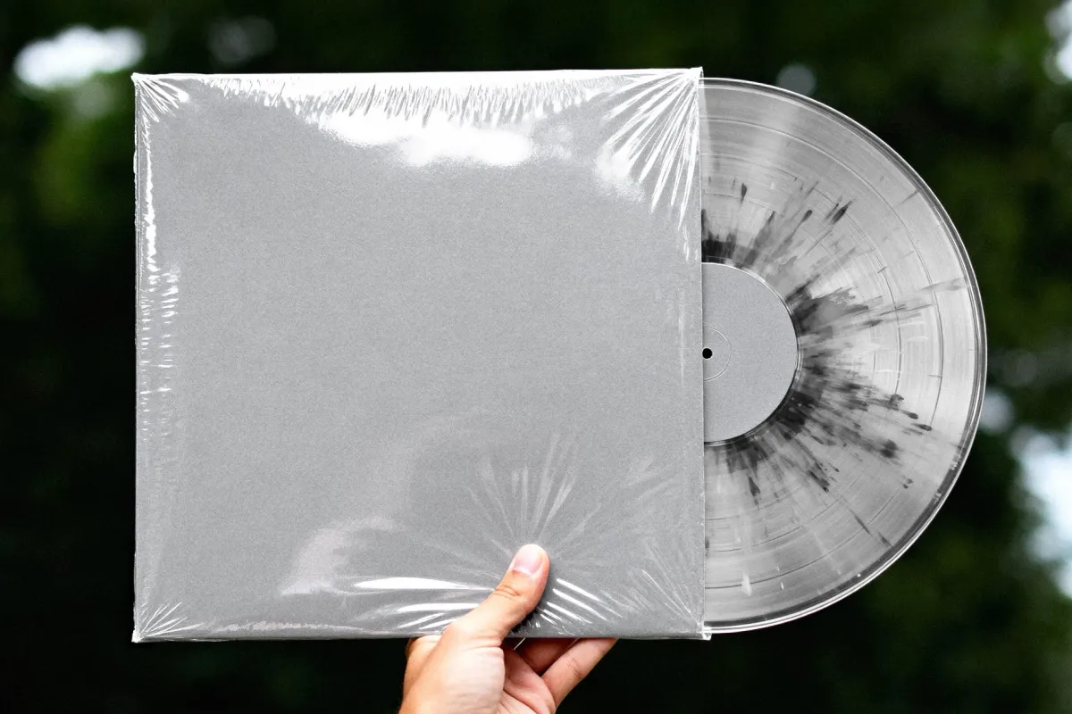 Hand Holding Vinyl Record Mockup