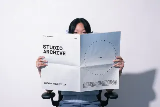 Girl Holding Paper Print Mockup