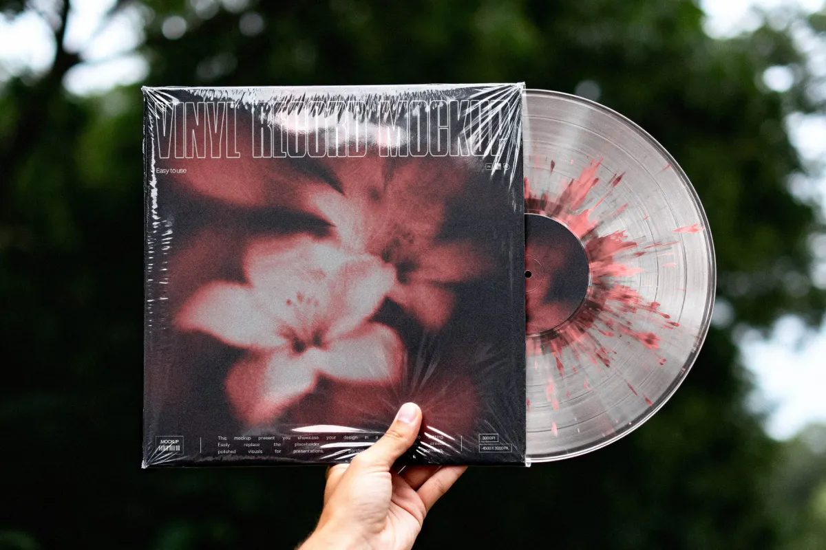 Hand Holding Vinyl Record Mockup