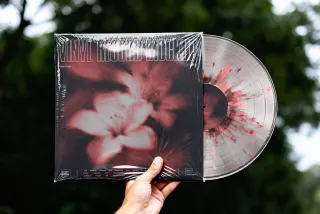 Hand Holding Vinyl Record Mockup
